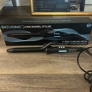 Bio Ionic 1 inch long barrel curling iron with box. Like new.